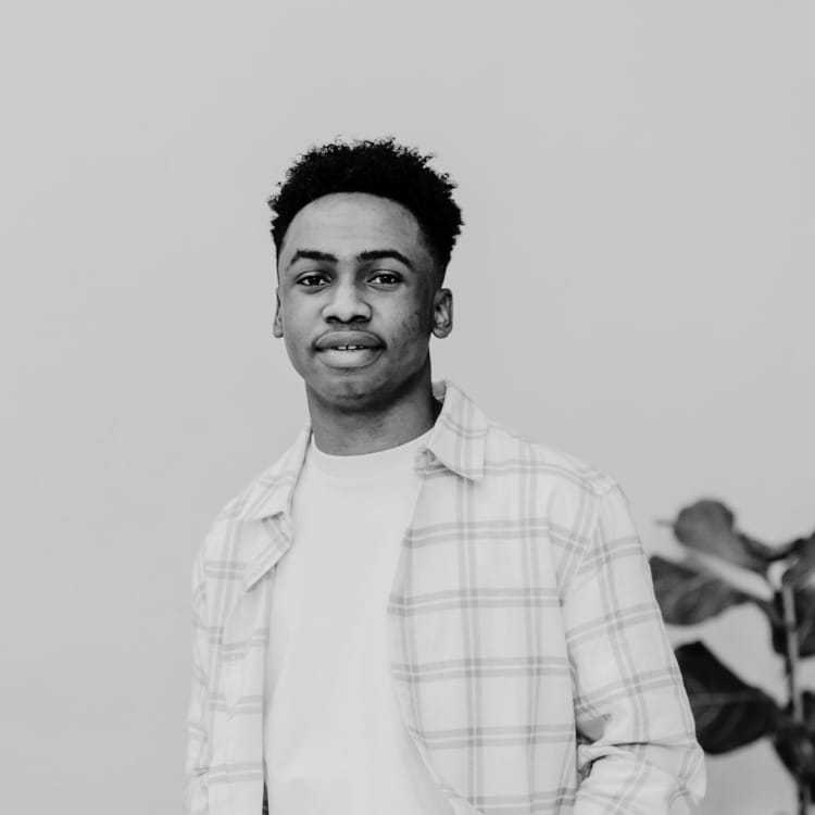 Portrait of Lucas, a professional stylist at Jubi Salon, showcasing their expertise and style.